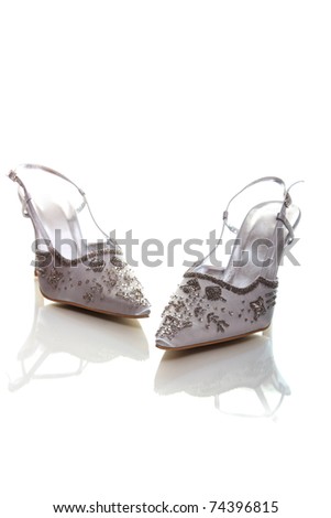 stock photo Elegant wedding shoes over white background