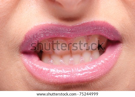 Closeup portrait of beautiful woman face mouth makeup zone. Macro