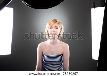 Young model in photographer\'s studio getting her beauty shots done