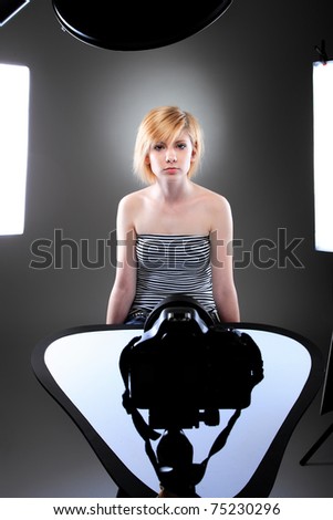 Young model in photographer\'s studio getting her beauty shots done