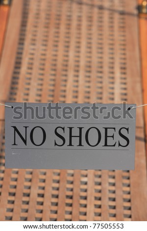 bridge of a private luxury ship with a no shoes sign