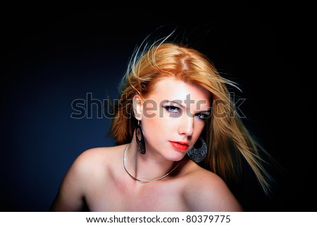 Portrait of glamour woman over dark gray background