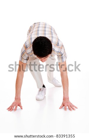 man in pose of low start over white background