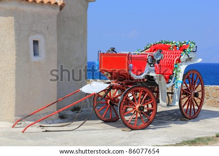 Decorated wedding horse carriage by the sea in Greece