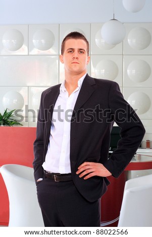 Smiling businessman  at the office reception