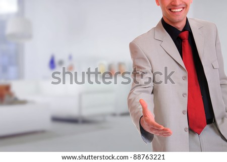 Cropped view of business man extending hand to shake