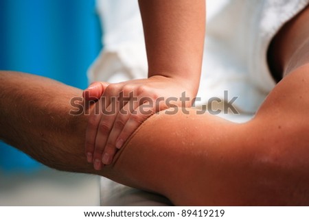 Man receiving massage relax treatment close-up from female hands