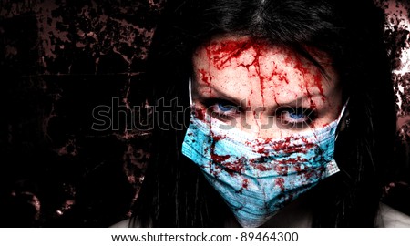 Young nurse in mask covered of blood