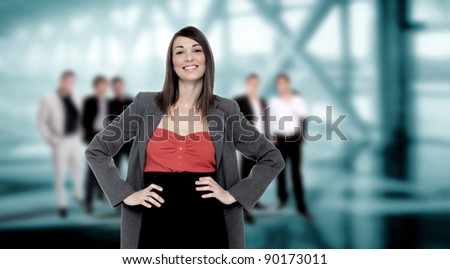 Portrait of successful businesswoman and business-team at office meeting