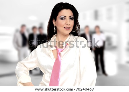 Portrait of successful businesswoman and business-team at office meeting