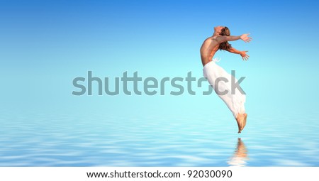 Young man jumping in the water