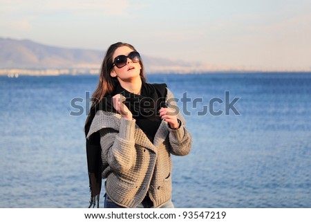 beautiful woman by the sea in Greece