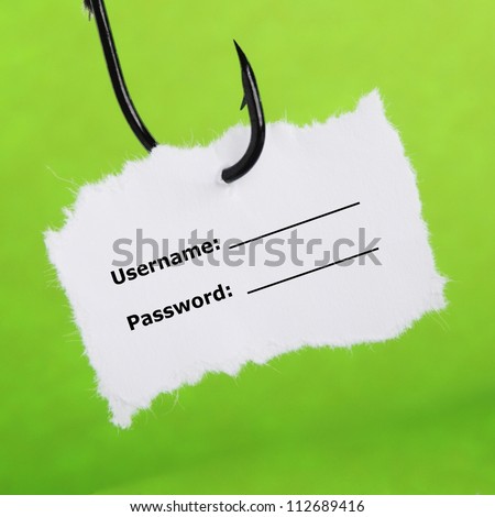 paper note on a fishing hook on green background