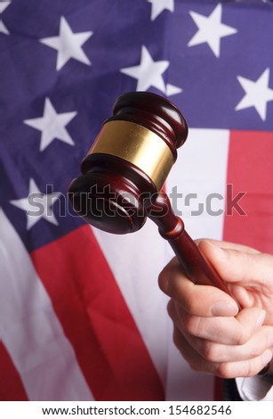 american court, gavel in front of an american flag