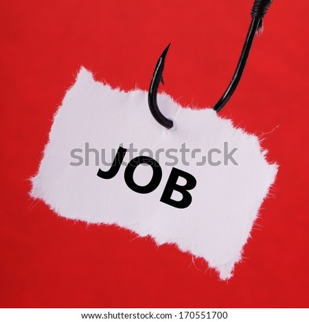 paper note on a fishing hook on red background