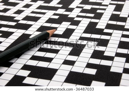 a shot of a crossword puzzle and pen