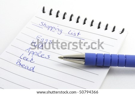 shopping list with blue pen isolated on white background