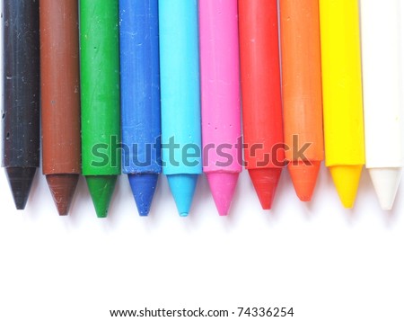different colored wax crayons isolated on white background