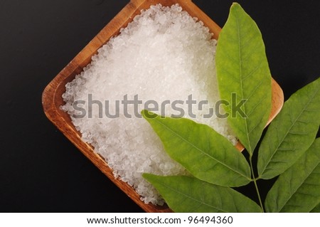 bay salt with green leave on black background