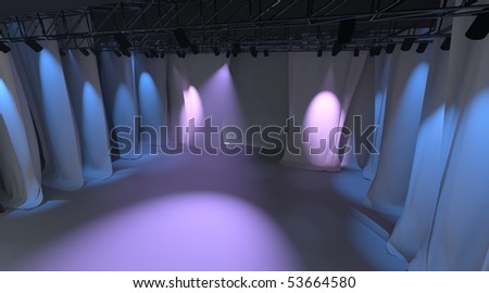 Empty stage with purple lights and curtain