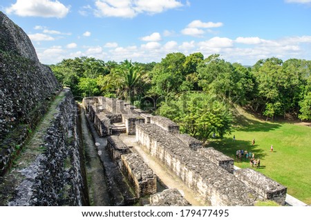 XUNANTUNICH, BELIZE - January 04, 2012: Tourists learn about the ancient Mayan pyramid on January 04, 2012 in Xunantunich, Belize