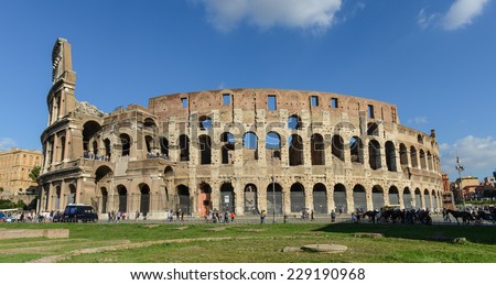 ROME - OCTOBER 18: Coliseum exterior on October 18, 2014 in Rome, Italy. The Coliseum is one of Rome's most popular tourist attractions with over 5 million visitors per year.