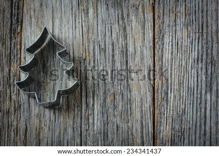 Christmas Tree Cookie Cutter on Rustic Wood Background