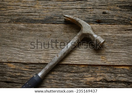 hammer on rustic hardwood floor