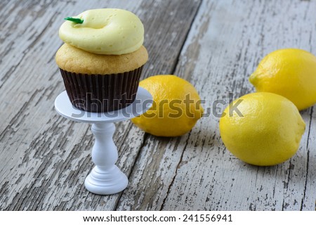Lemon Cupcake with Fresh Lemons on a Cupcake Stand