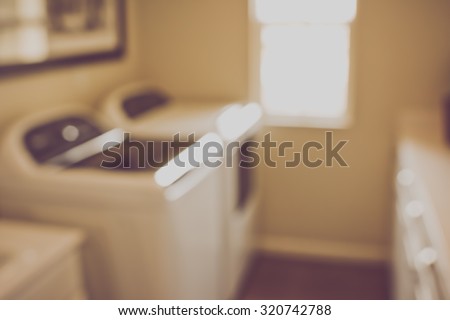 Blurred Laundry Room with Washer and Dryer with Retro Instagram Style Filter