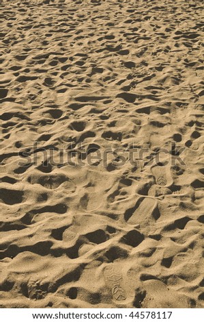 Sand Background with several foot prints
