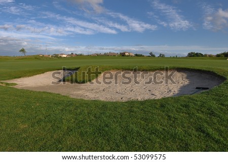Sand Trap on Golf Course with Blue Sky