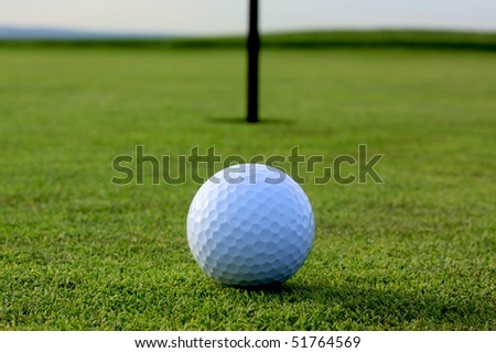 golf ball on tee in a golf club