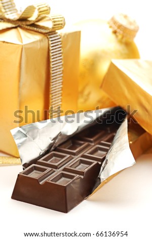 Golden Christmas gift box and chocolate bar