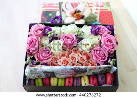 gift box with flowers with cake macaroon