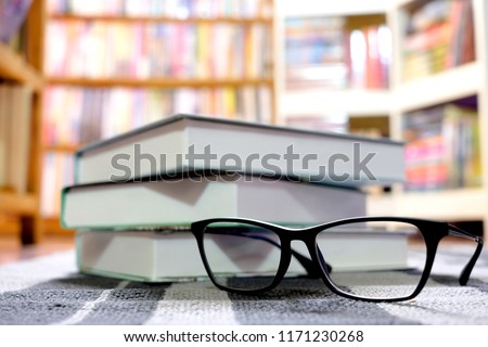 Glasses and books Placed at the library\
Educational and academic Ideas