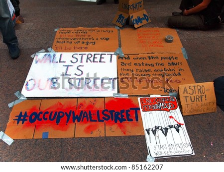 NEW YORK - SEPT. 21: Political messages are displayed at Zuccotti Park during the  Occupy Wall St. demonstration near the New York Stock Exchange on September 21, 2011 in New York City.