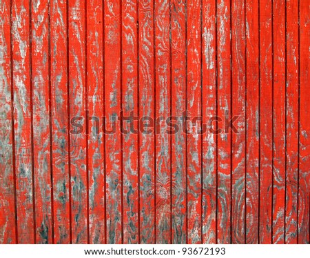 A rustic old shack with peeling red paint makes a versatile background.