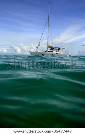 people on sailing boat in the pacific ocean, taken in Samoa