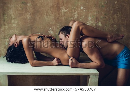 Sensual couple during hot and sexy moments. Orgasm concept. Beautiful lady and guy in erotic pose. Portrait of girl and boy indoors. Sexy girl. Sportswoman. Fitness. Slim girl in black body.