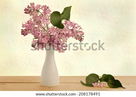 picture fresh sprigs of lilac in a white vase stylized 50-60 years