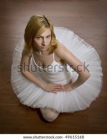 Ballerina seated on floor