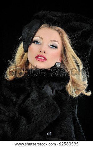 stock-photo-sexy-blond-girl-in-black-fur-coat-62580595.jpg