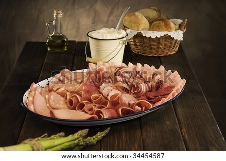 sliced salami and cured meat on dining table