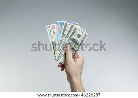 hand holding banknotes