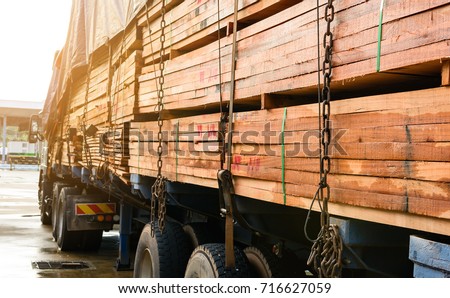 Timber transport truck Park waiting for inspection with lumber for construction.selective focus