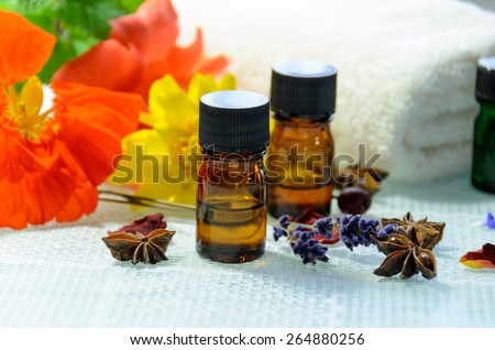 essential oils with spice and herbal flowers