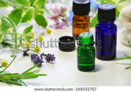 aromatherapy oils with herbal flowers