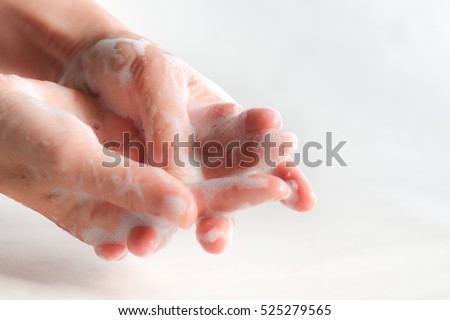 washing hands using soap foam