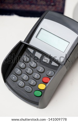 Point of sale credit card terminal used to process electronic payments at stores.